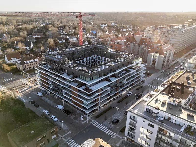 the green white concrete residential building