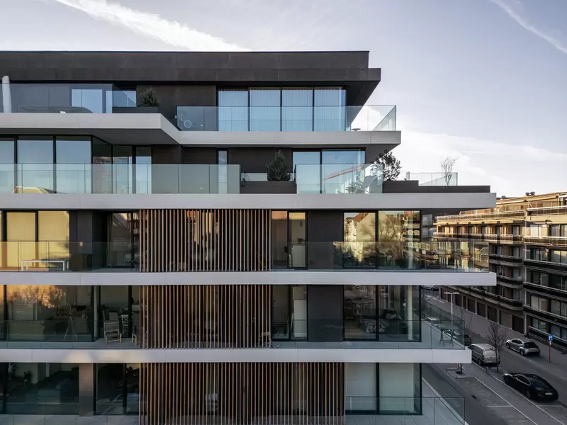 the green white concrete residential building