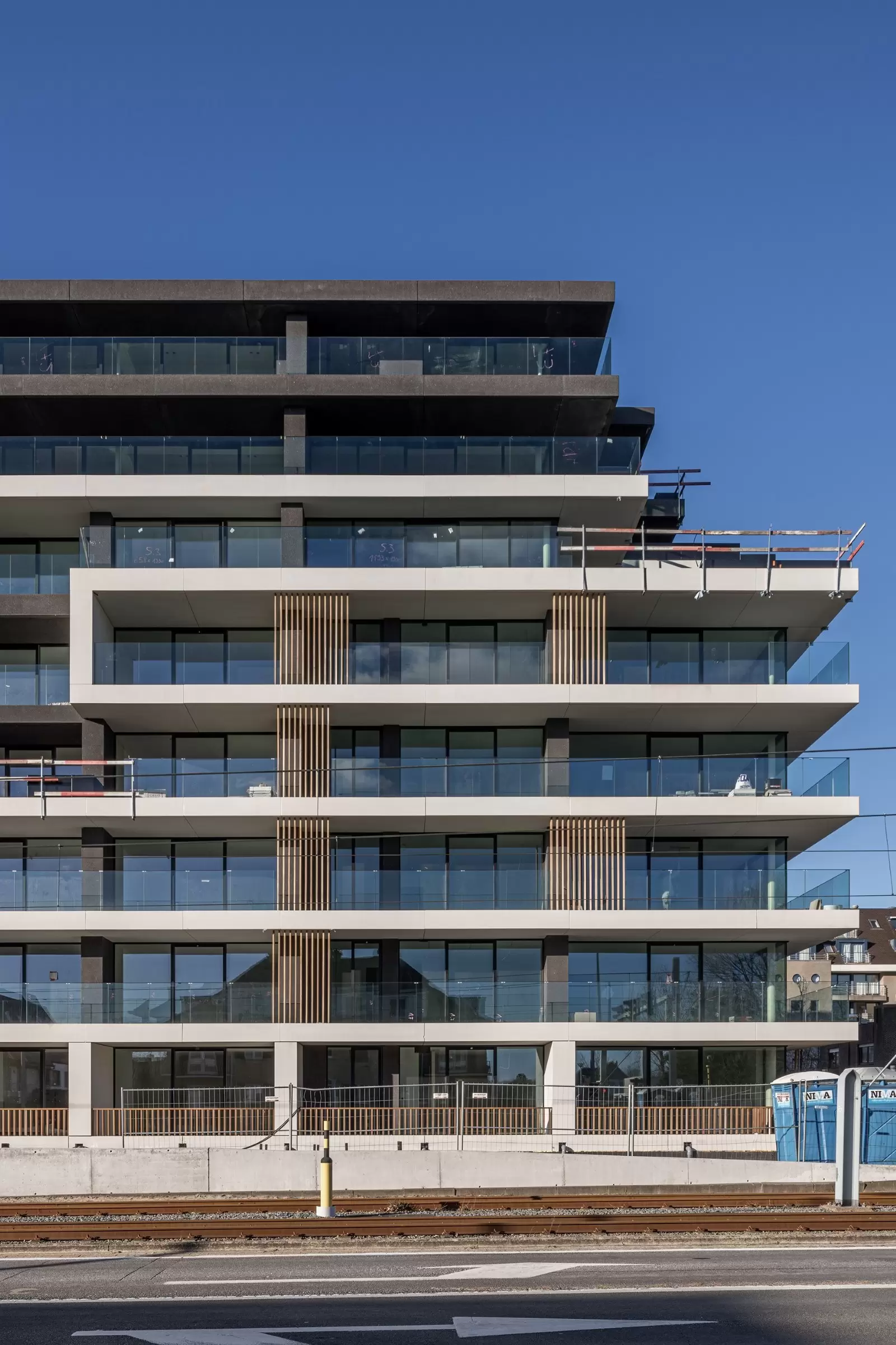 the green white concrete residential building